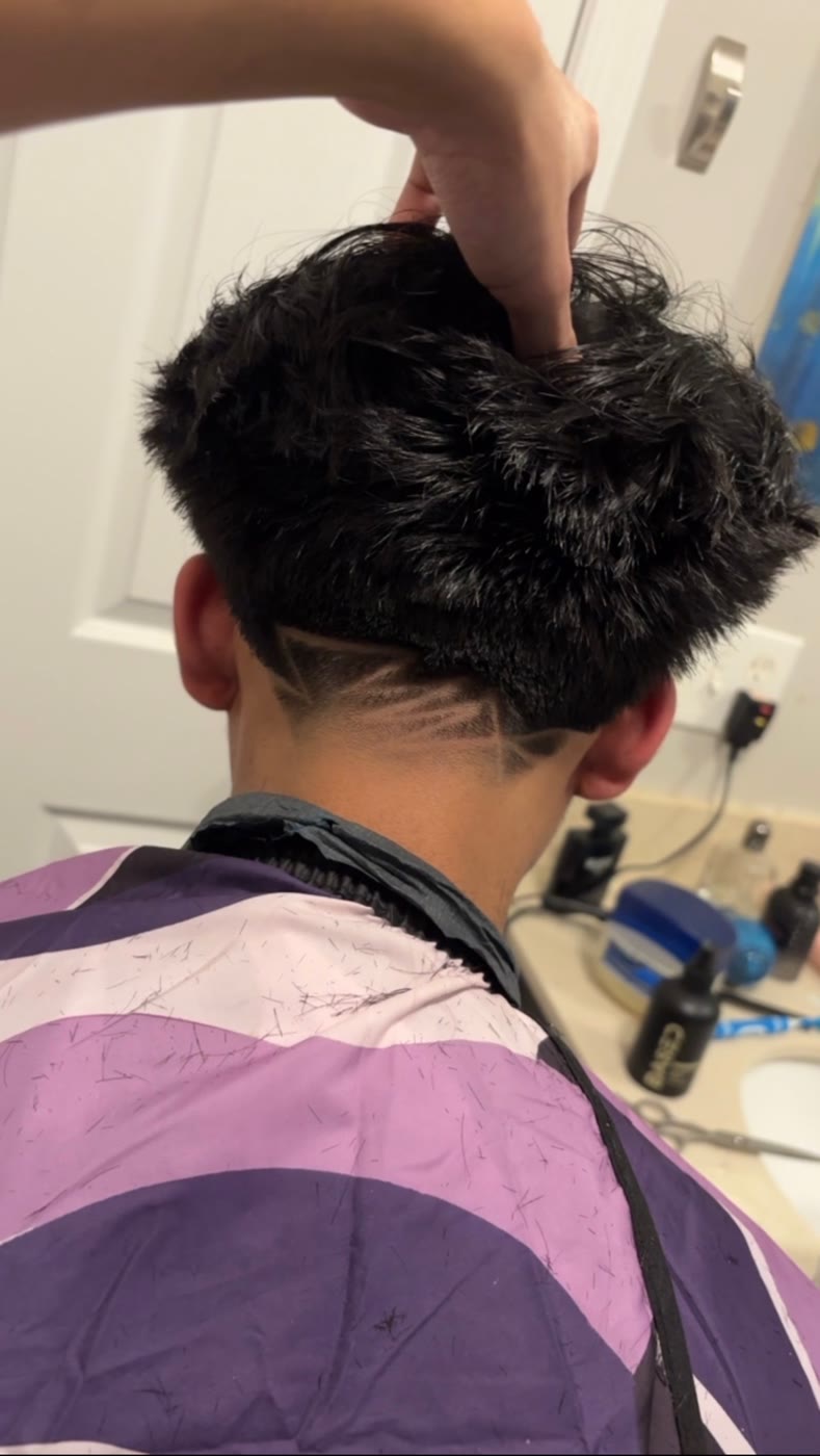 Textured cut with hair design by Mblendzz barber in Ashburn, VA