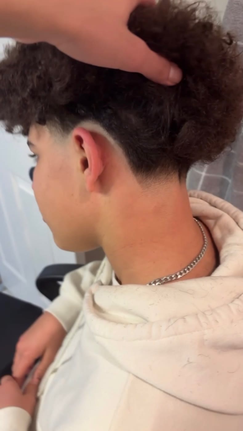 Curly hair taper fade by Mblendzz barber in Ashburn, VA